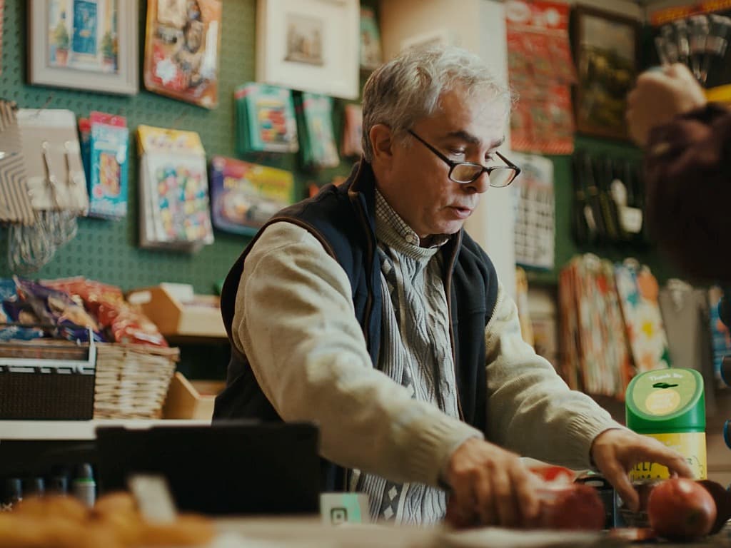 Man Looking Over Counter