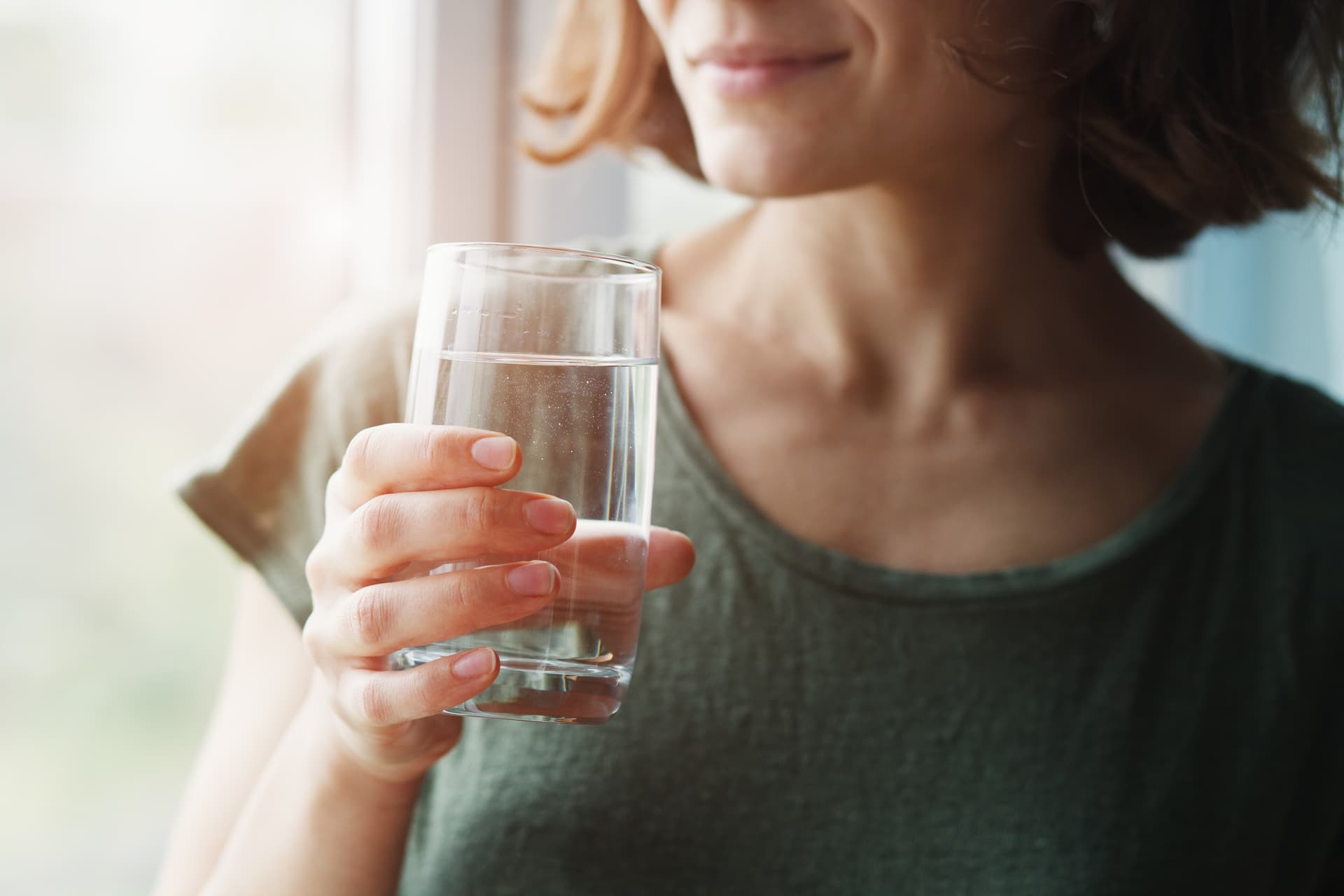 woman drinking glass of water