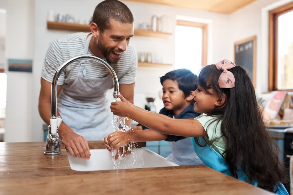 Man and child washing up