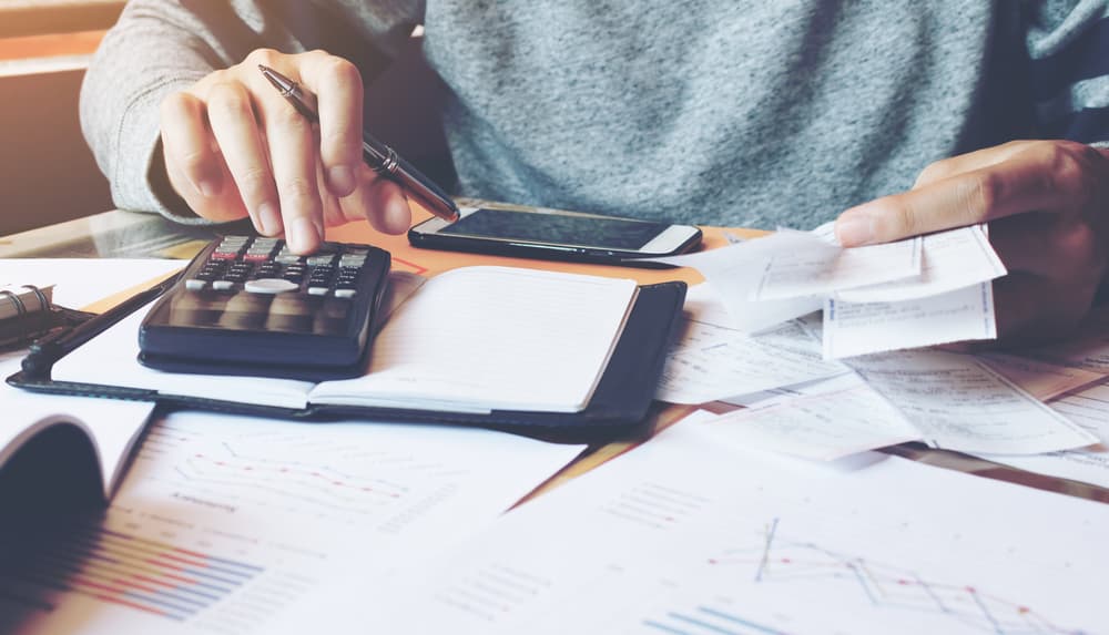 bill and calculators on table